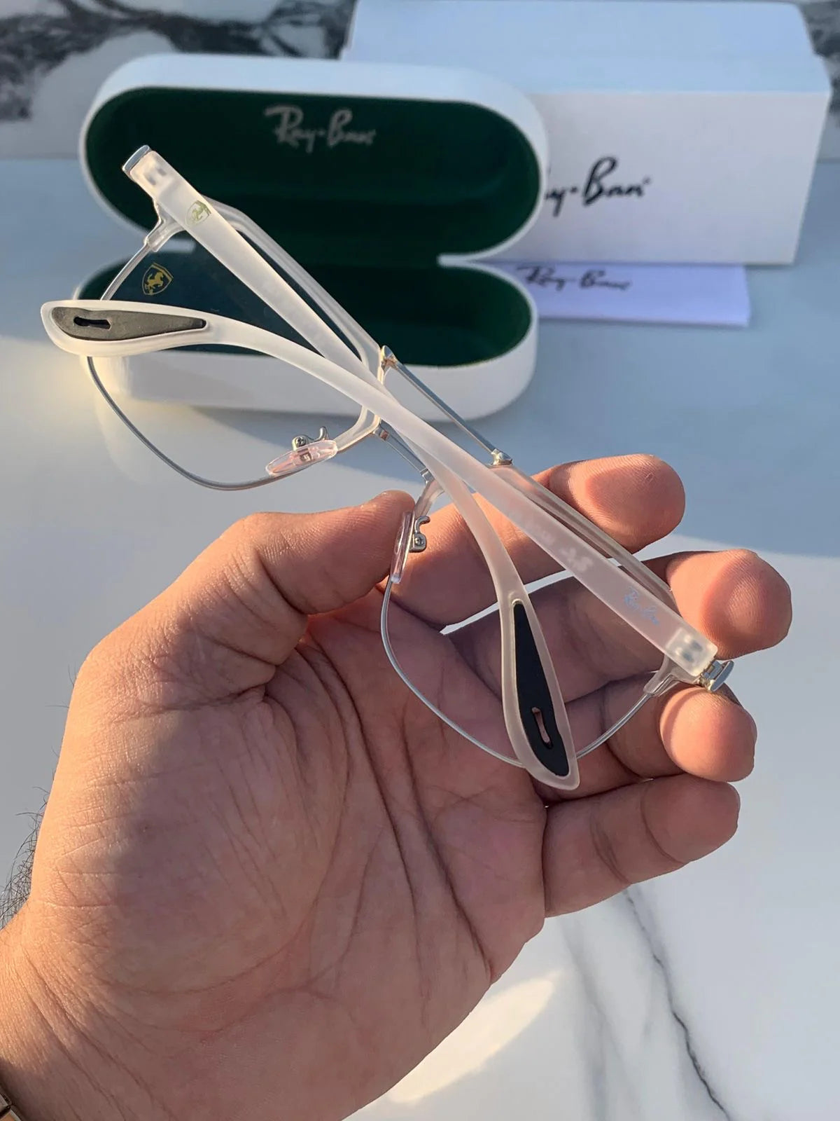 Ray-Ban 04 white plano eyeglasses.