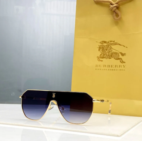 Burberry aviator sunglasses gold-tone metal frame and blue gradient lenses.