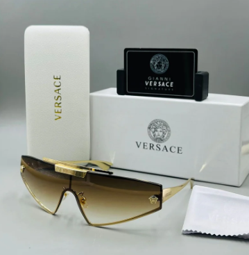 Versace shield sunglasses with a gold metal frame and dark grey/mirror gold lenses.