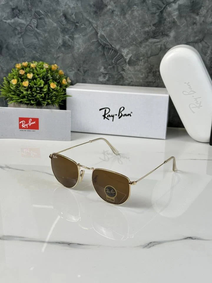 Ray-Ban Hexagonal Flat Lenses sunglasses with a gold metal frame and brown gradient lenses.