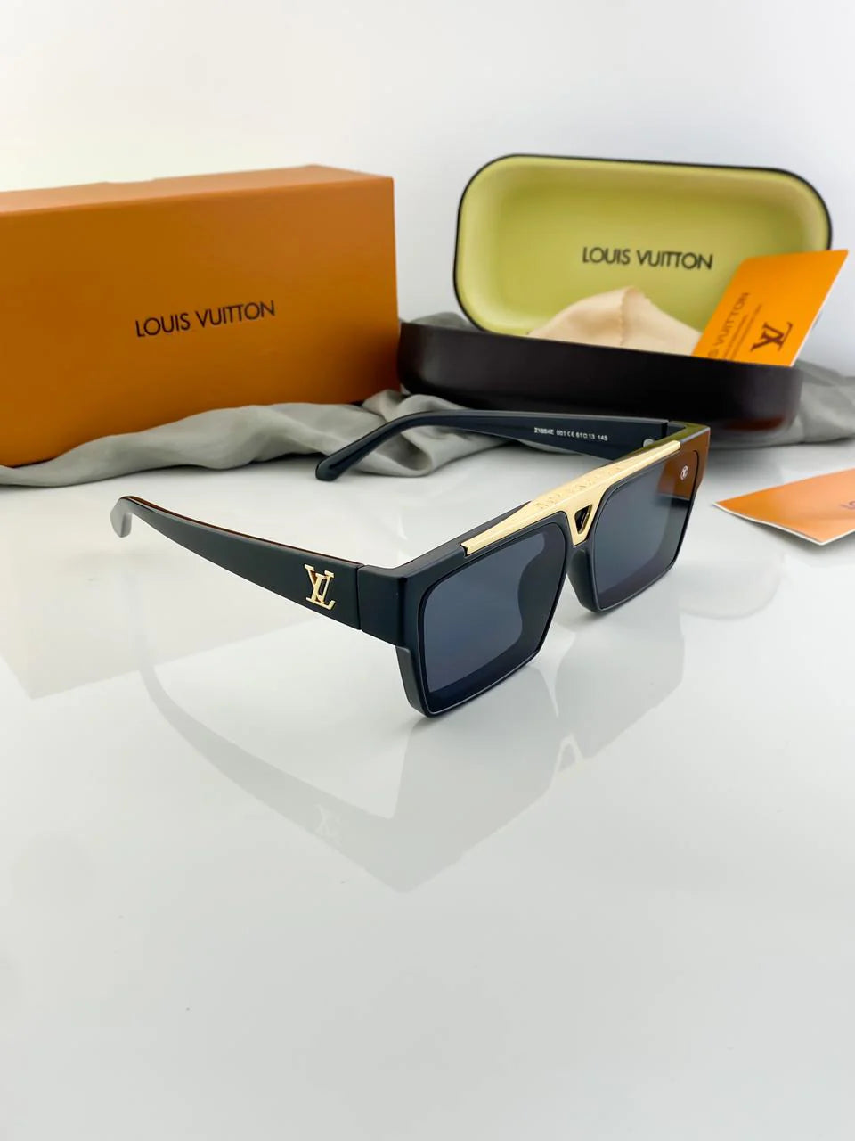 Louis Vuitton 1.1 Evidence sunglasses in black with gold-color hardware.