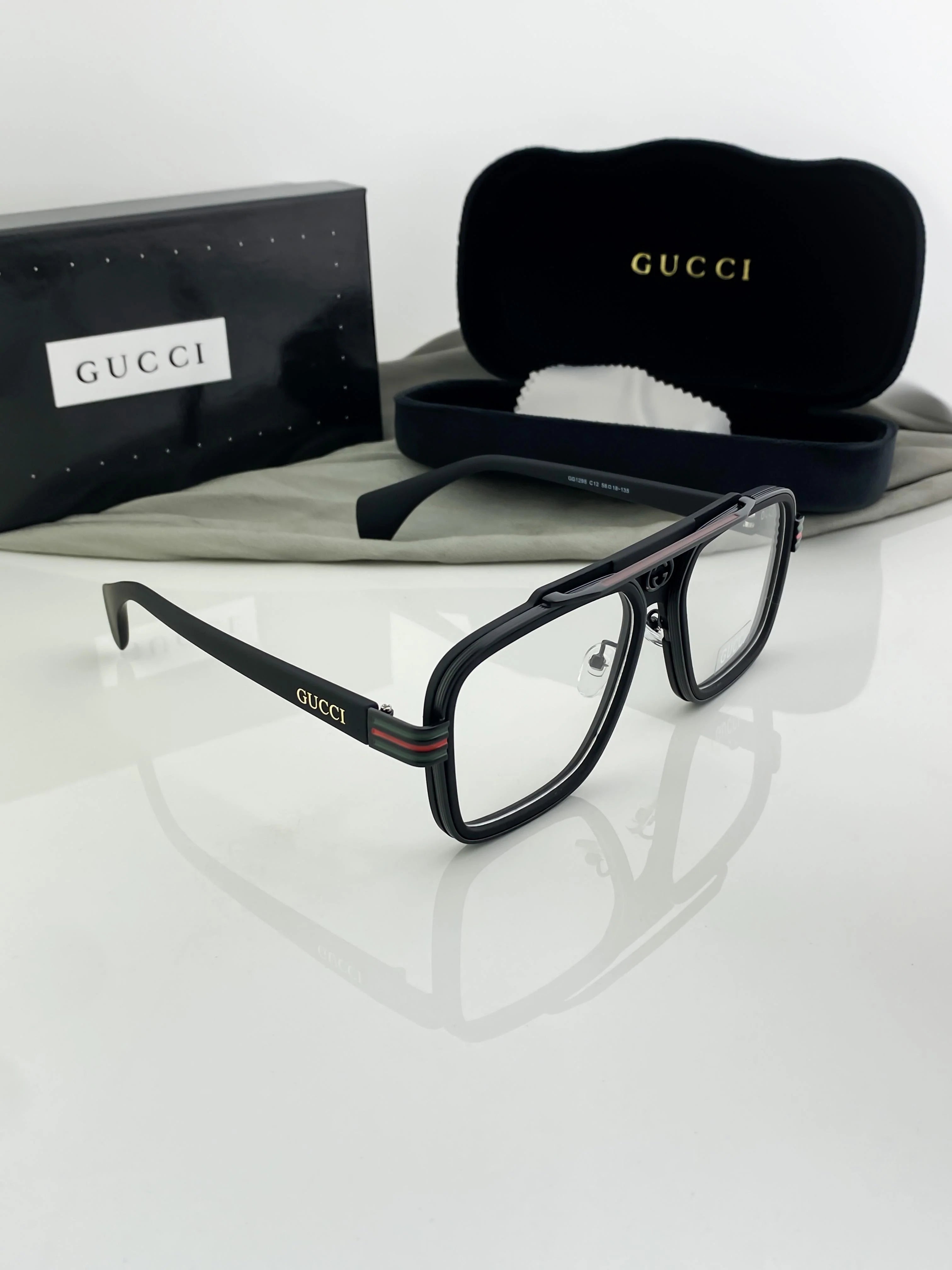 black Gucci GG0026O acetate aviator-style eyeglasses.